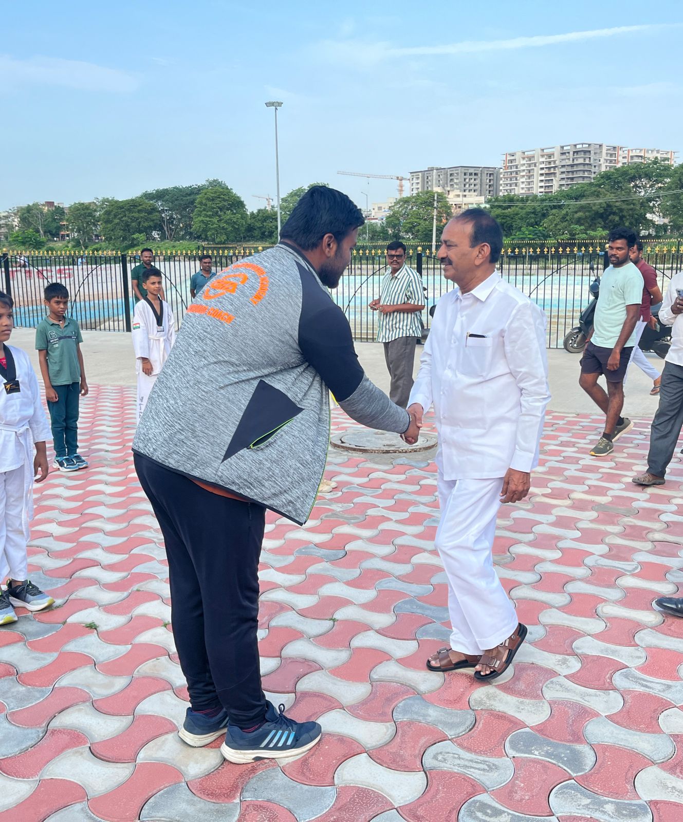 Coach with dignitary at academy event