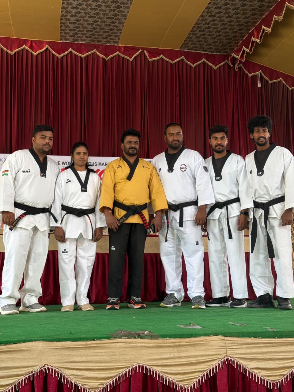 Ganghan black belt instructors and coaching team at a martial arts event