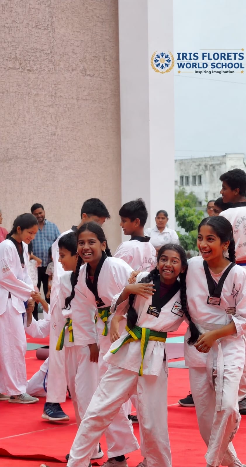 Young Taekwondo students smiling during class at Ganghan Taekwondo Academy, L.B. Nagar
