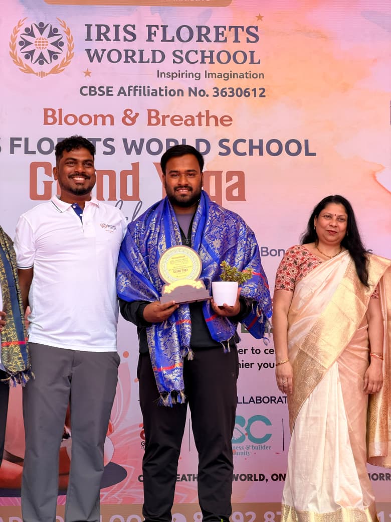 Ganghan head coach felicitated with an award at a school event